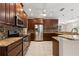 Spacious kitchen featuring stainless steel appliances and granite countertops at 7333 S Trask St, Tampa, FL 33616