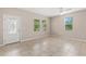 Bright living room featuring tiled floors, with views of the outside through the windows at 7333 S Trask St, Tampa, FL 33616