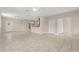 Open concept living space with tile flooring, seamlessly flowing into the kitchen area at 7333 S Trask St, Tampa, FL 33616