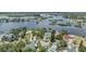 Scenic aerial view of a waterfront community with lush trees and a serene body of water at 751 Bayshore Dr, Tarpon Springs, FL 34689