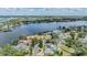 Scenic aerial view of a waterfront community with lush trees and a serene body of water at 751 Bayshore Dr, Tarpon Springs, FL 34689