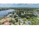 Scenic aerial view of a waterfront community with lush trees and a serene body of water at 751 Bayshore Dr, Tarpon Springs, FL 34689