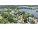 Picturesque aerial view of waterfront homes surrounded by lush greenery and serene waters at 751 Bayshore Dr, Tarpon Springs, FL 34689