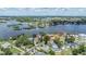 Scenic aerial view of a waterfront community with lush trees and a serene body of water at 751 Bayshore Dr, Tarpon Springs, FL 34689