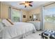 Comfortable bedroom with large windows, tiled floors, and ceiling fan at 751 Bayshore Dr, Tarpon Springs, FL 34689