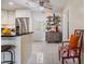 Bright kitchen features white cabinets, stainless steel refrigerator, and decorative shelf at 751 Bayshore Dr, Tarpon Springs, FL 34689