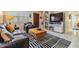 Inviting living room with comfortable seating, a stylish rug, and a bright window at 751 Bayshore Dr, Tarpon Springs, FL 34689