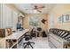 Office space with tiled floors, desk, ceiling fan, and storage space at 751 Bayshore Dr, Tarpon Springs, FL 34689
