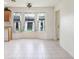 Bright breakfast nook with tile floors and windows with patterned curtains at 7841 Royal Stewart Dr, New Port Richey, FL 34653