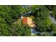 Aerial shot of home surrounded by mature trees at 8600 Shenandoah Run, Wesley Chapel, FL 33544