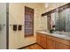 Well-lit bathroom with double sinks, granite countertops, and a decorative mirror at 8600 Shenandoah Run, Wesley Chapel, FL 33544