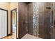 Modern bathroom featuring a glass-enclosed shower with designer tile accents at 8600 Shenandoah Run, Wesley Chapel, FL 33544
