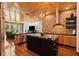 Open kitchen with stone accents, stainless steel appliances, and central island at 8600 Shenandoah Run, Wesley Chapel, FL 33544