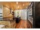 Modern kitchen with stone accents, stainless steel appliances, and ample counter space at 8600 Shenandoah Run, Wesley Chapel, FL 33544