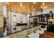Modern kitchen with stone accents, stainless steel appliances, and bar seating at 8600 Shenandoah Run, Wesley Chapel, FL 33544