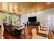 Bright living room with hardwood floors, recessed lighting, and a sleek electric fireplace at 8600 Shenandoah Run, Wesley Chapel, FL 33544