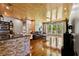 Spacious living room featuring beautiful hardwood floors and plentiful natural light from large windows at 8600 Shenandoah Run, Wesley Chapel, FL 33544