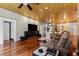 Spacious living room with hardwood floors, stone fireplace, sleek furniture, and modern lighting at 8600 Shenandoah Run, Wesley Chapel, FL 33544