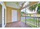 Relaxing screened-in balcony with a ceiling fan, storage, and views of the community at 9481 Highland Oak Dr # 1506, Tampa, FL 33647