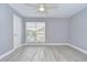 Spacious bedroom with a ceiling fan and large window offering plenty of natural light at 9481 Highland Oak Dr # 1506, Tampa, FL 33647