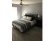Serene bedroom featuring a comfortable bed with stylish bedding, bedside tables, and contemporary decor at 9481 Highland Oak Dr # 1506, Tampa, FL 33647