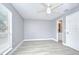 Bright bedroom with an ensuite bathroom and natural light from a large window at 9481 Highland Oak Dr # 1506, Tampa, FL 33647