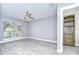 Well-lit bedroom with a ceiling fan and a storage cabinet for added functionality at 9481 Highland Oak Dr # 1506, Tampa, FL 33647
