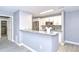 Modern kitchen with marble countertop and stainless steel appliances and open to the dining area at 9481 Highland Oak Dr # 1506, Tampa, FL 33647