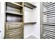 Custom walk-in closet with built-in shelves and drawers for storage solutions at 9481 Highland Oak Dr # 1506, Tampa, FL 33647