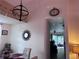 A view of the dining room featuring a chandelier, adjacent to the dining room and kitchen at 10102 Missy Ct, Tampa, FL 33615