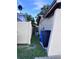 Exterior view showing the side yard, fence, and storage bins at 10102 Missy Ct, Tampa, FL 33615