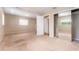 Bedroom featuring carpet floors, light walls, windows and a closet with sliding doors at 104 Foxwood Dr, Brandon, FL 33510