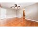 Spacious bedroom with hardwood floors, ceiling fan, and an ensuite bathroom at 104 Foxwood Dr, Brandon, FL 33510