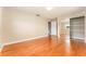 Bedroom featuring wood floors, an open door and closet with mirrored doors at 104 Foxwood Dr, Brandon, FL 33510
