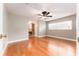 Large bedroom with hardwood floors, a ceiling fan, and plenty of natural light at 104 Foxwood Dr, Brandon, FL 33510