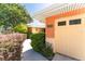 Exterior home detail showcasing the address and a well-manicured hedge at 104 Foxwood Dr, Brandon, FL 33510