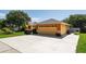 A spacious two-car garage and driveway with ample parking space on a sunny day at 104 Foxwood Dr, Brandon, FL 33510