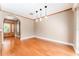 Inviting living room with hardwood floors, a large front door, and neutral wall colors at 104 Foxwood Dr, Brandon, FL 33510
