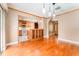 Open-concept living room with hardwood floors, and an open flow to the kitchen and dining area at 104 Foxwood Dr, Brandon, FL 33510