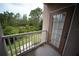 Balcony with a view of lush greenery and a sidewalk at 10409 Villa View Cir # 10409, Tampa, FL 33647