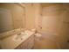 Bathroom featuring vanity, toilet, bathtub and shower, providing a functional and comfortable space at 10409 Villa View Cir # 10409, Tampa, FL 33647