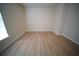 Spacious room with hardwood floors, ample natural light, and neutral walls, creating a blank canvas at 10409 Villa View Cir # 10409, Tampa, FL 33647