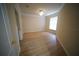 Neutral bedroom featuring wood-look flooring and a ceiling fan for comfort at 10409 Villa View Cir # 10409, Tampa, FL 33647