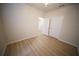 Cozy bedroom featuring hardwood floors and ample closet space, providing a comfortable and functional area at 10409 Villa View Cir # 10409, Tampa, FL 33647