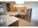 Bright kitchen with stainless steel appliances, quartz countertops, and wooden cabinets at 10409 Villa View Cir # 10409, Tampa, FL 33647