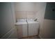 Functional laundry room with modern appliances and shelving for storage at 10409 Villa View Cir # 10409, Tampa, FL 33647