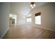 Bright living room with hardwood floors, a fireplace, a chandelier, and high ceilings at 10409 Villa View Cir # 10409, Tampa, FL 33647