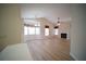 Spacious living room with large bay windows, a ceiling fan, and a fireplace at 10409 Villa View Cir # 10409, Tampa, FL 33647