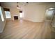 Large, open living room with hardwood flooring and a fireplace at 10409 Villa View Cir # 10409, Tampa, FL 33647