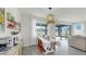 Inviting dining room with backyard access, decorative lighting, and bright, natural light at 10842 Rolling Moss Rd, Tampa, FL 33647